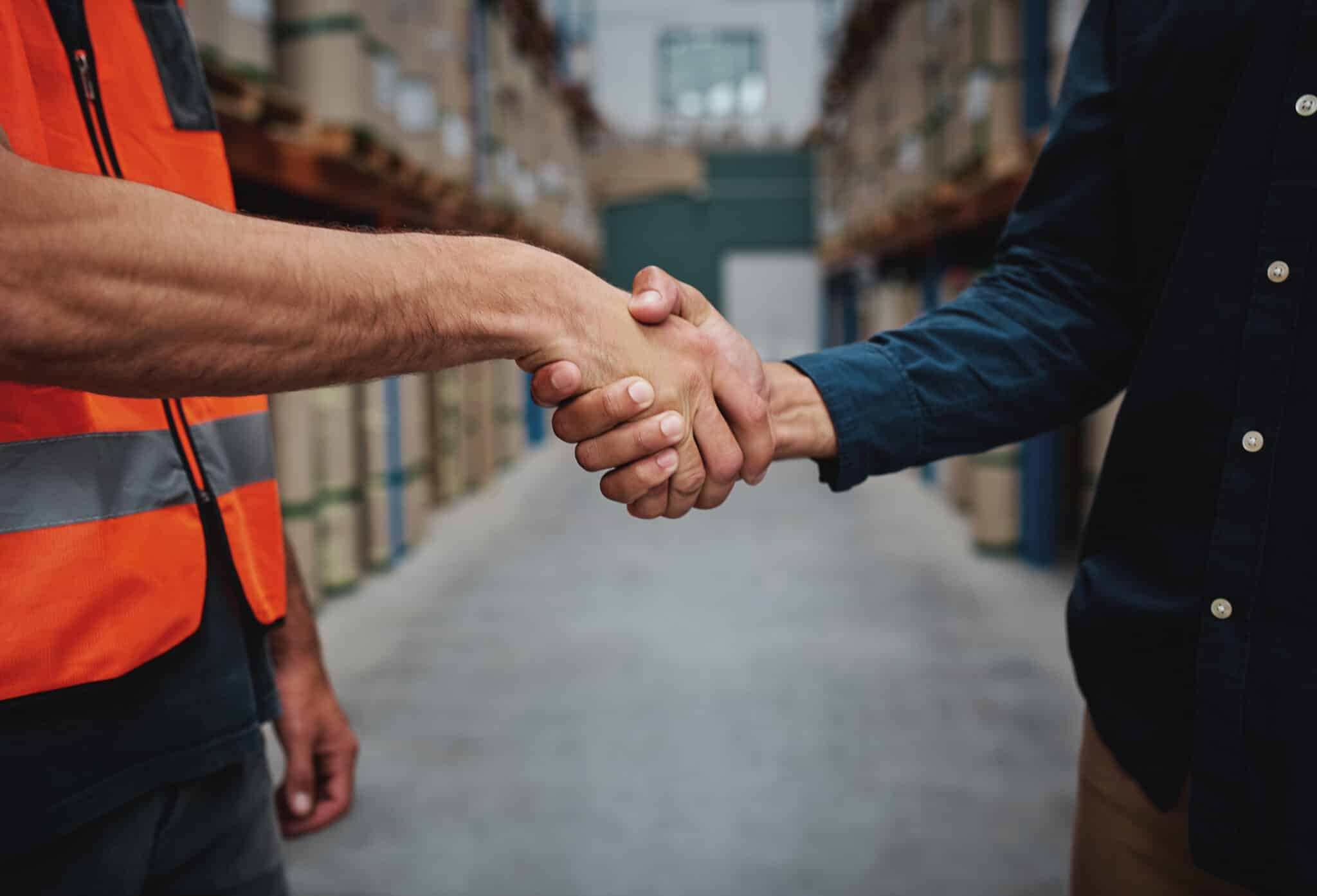 HeartBeep Marketing HVAC Lead Generation, Close-up of unrecognizable men concluding agreement about container rent and shaking hands