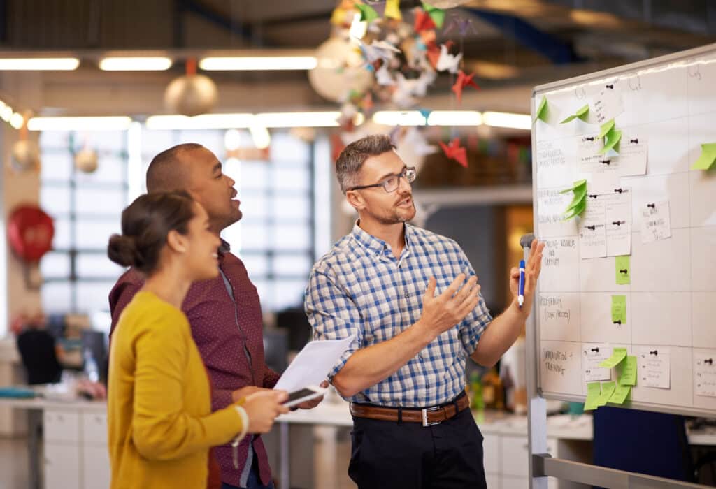 Heartbeep Marketing NH SEO Agency in Boston, Whiteboard, manager plan and business people with strategy and speaking in a office. Startup, company training and creative writing group with communication and vision with ideas and seo report.