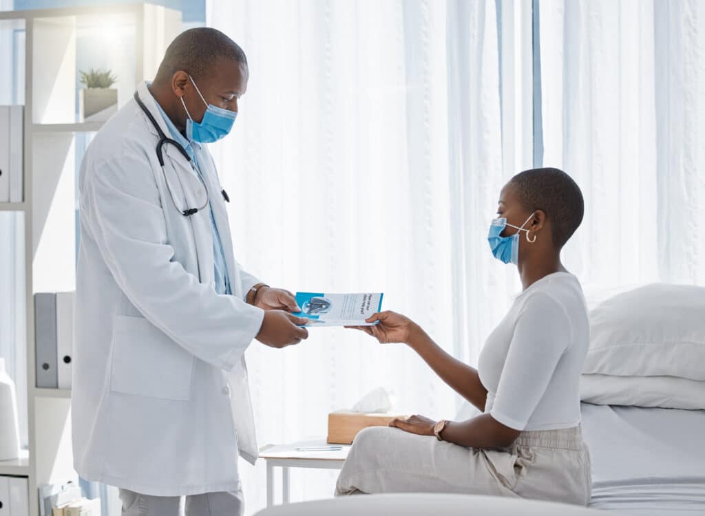 Covid doctor giving infographic or brochure about us page to patient in a healthcare clinic for more help, trust or insurance information. Medical professional giving marketing document to woman.